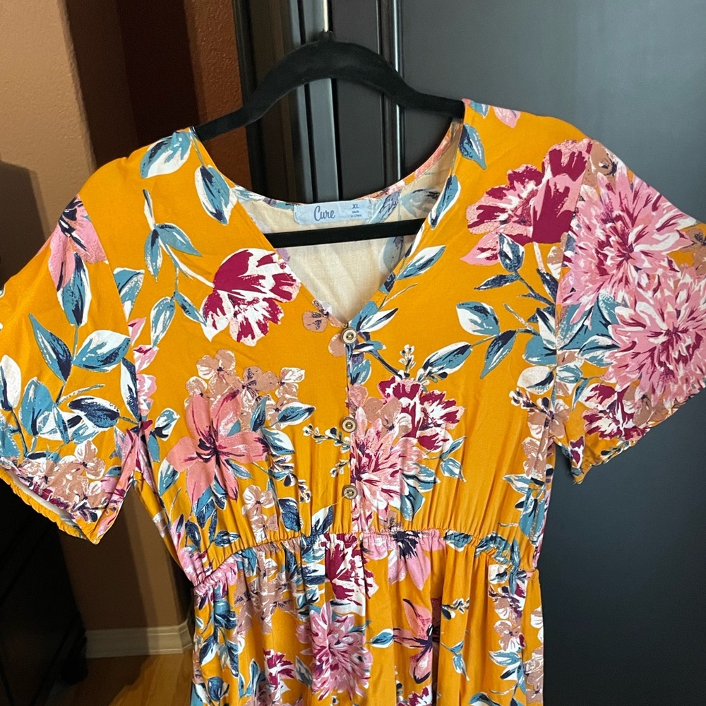 New dress. No tags but has never been worn. Size XL. Cure brand.